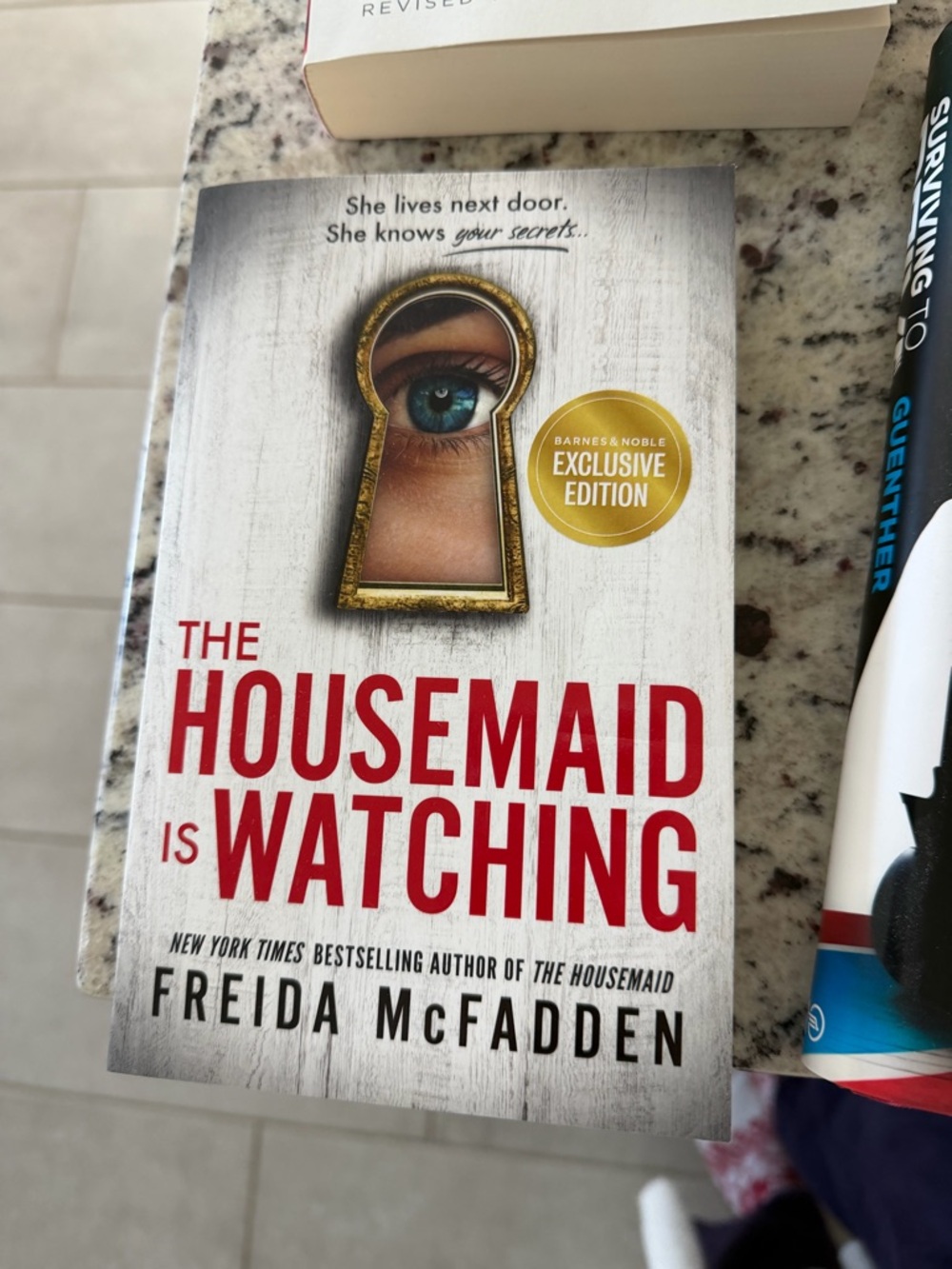 The Housemaid Is Watching by Freida McFadden - White & Red Cover